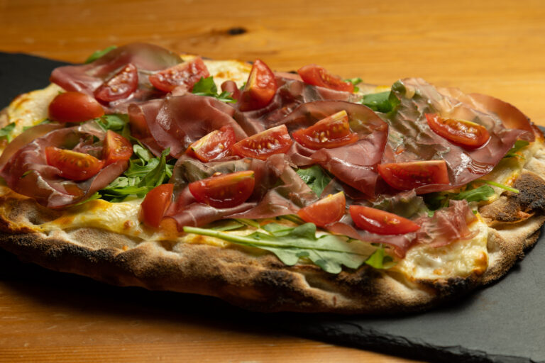 Pinsa Romana special pizza with a mix of flours and cereals baked in a wood-fired oven